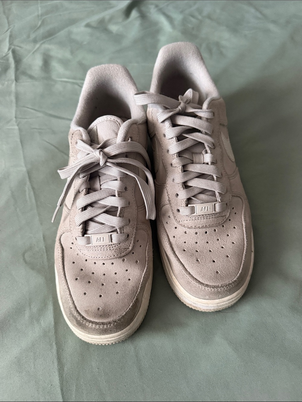 Nike Women’s Suede Low-Top Sneakers in Light gray